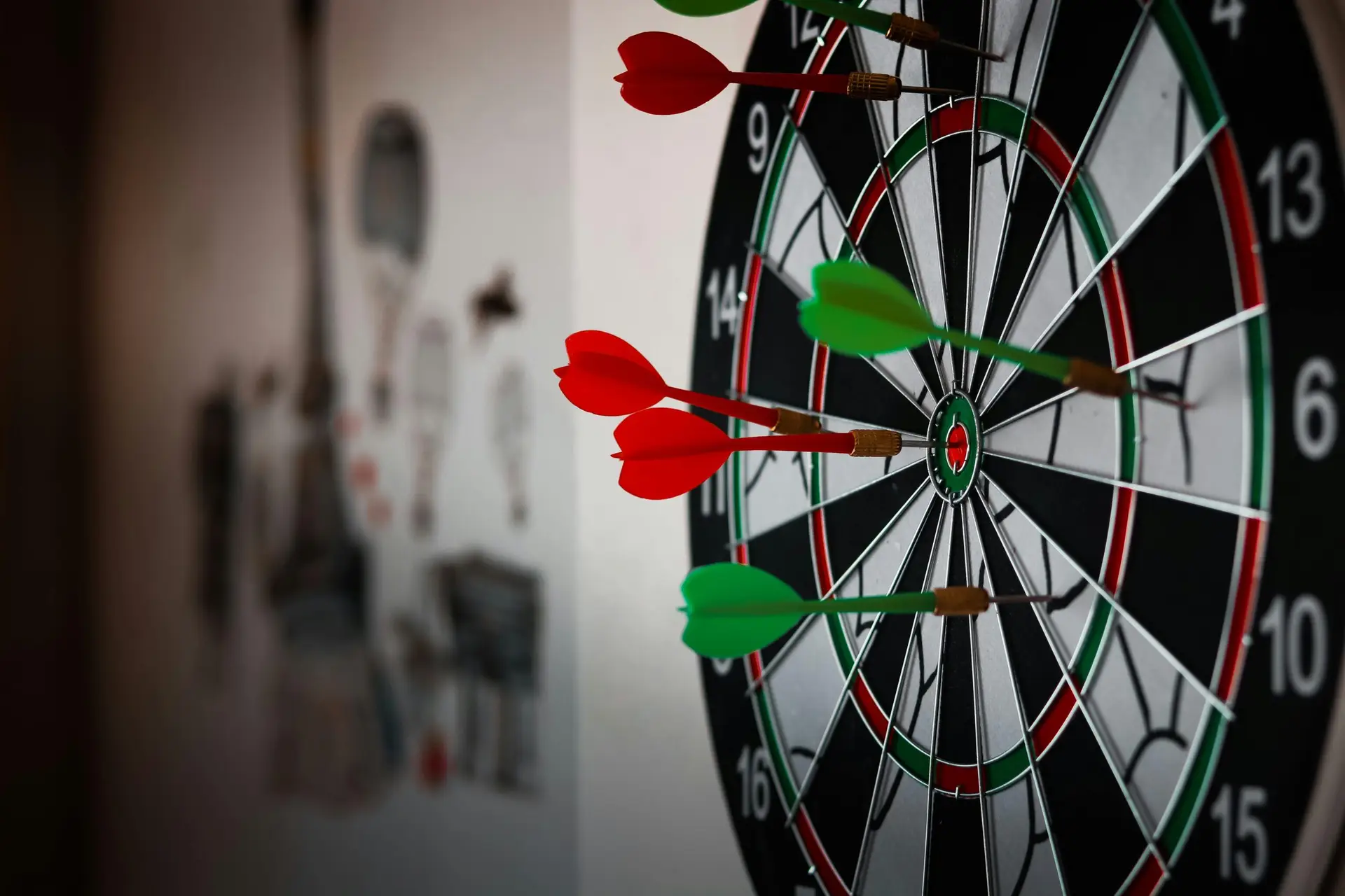 close-up dartboard with darts hitting the target, representing accuracy, focus, and performance tracking