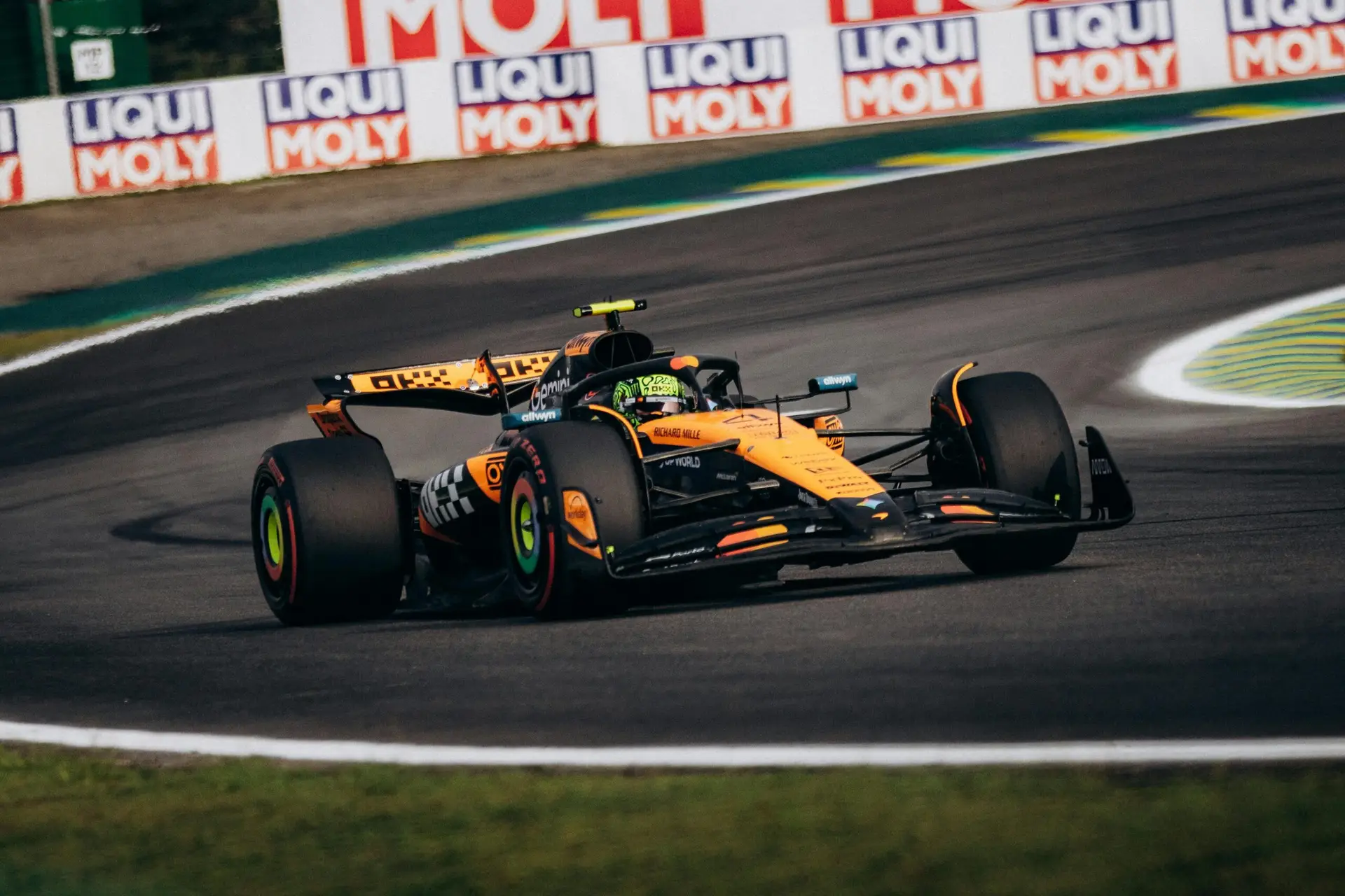Thrilling Formula 1 race captured at Interlagos Racetrack, São Paulo with a dynamic McLaren vehicle.