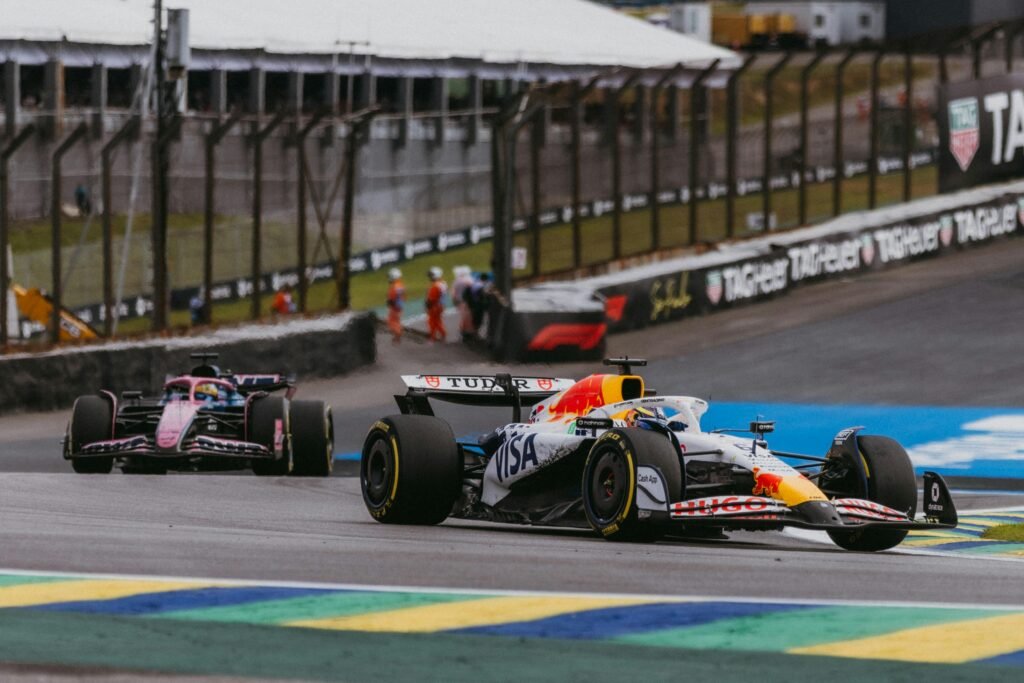 Exciting Formula 1 action with red bull cars racing in São Paulo, Brazil.